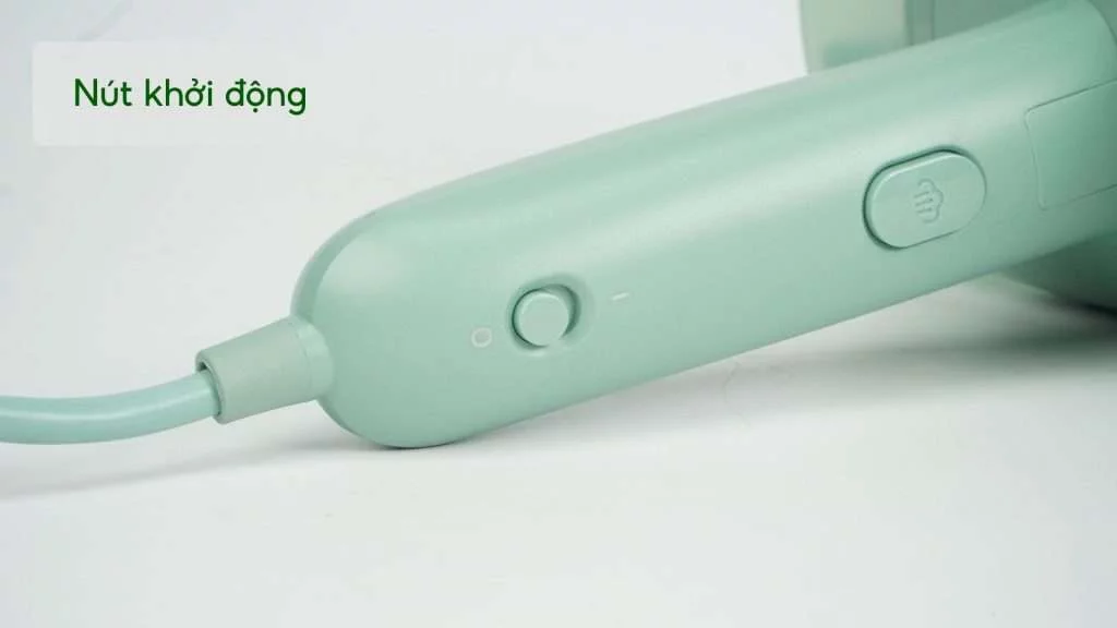 Bàn ủi hơi nước cầm tay Philips STH3010_70_Xanh ngọc Nút khởi động